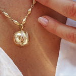 diamond halo ball gold locket in 18k gold with diamond engraving