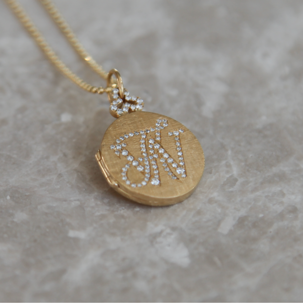 18k gold round classic locket with diamond monogram engraving