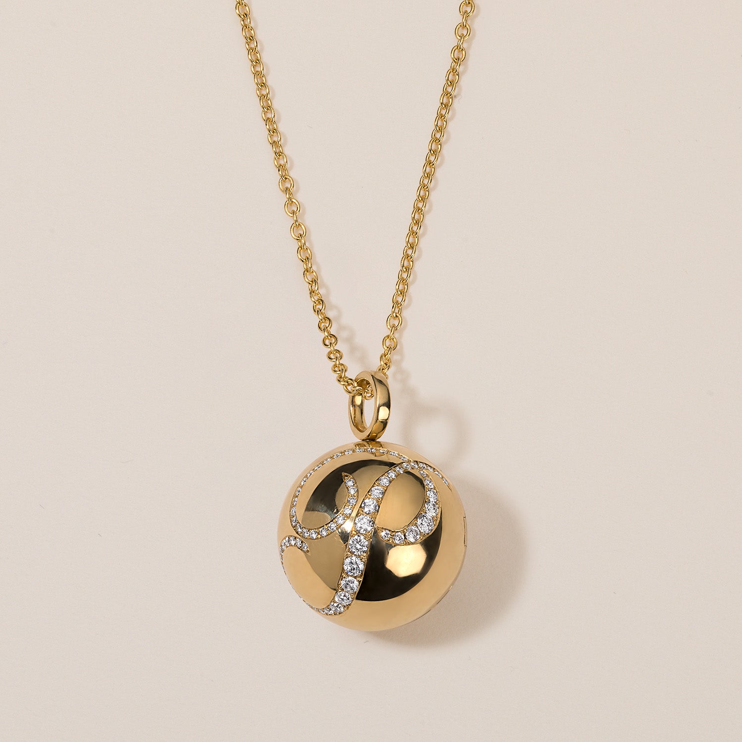 halo ball locket necklace in 18k gold with diamond engraving