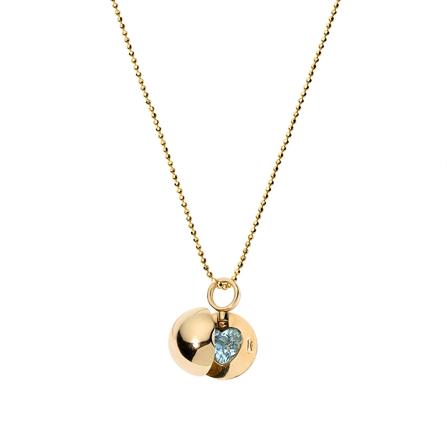 14k ball locket necklace adorned with a captivating turquoise heart center stone, exuding charm and elegance. This unique piece features a spherical locket design, complemented by the vibrant turquoise heart at its center. The rich blue-green hue of the turquoise stone adds a pop of color and sophistication to the understated beauty of the gold locket, making it a stunning addition to any jewelry collection.