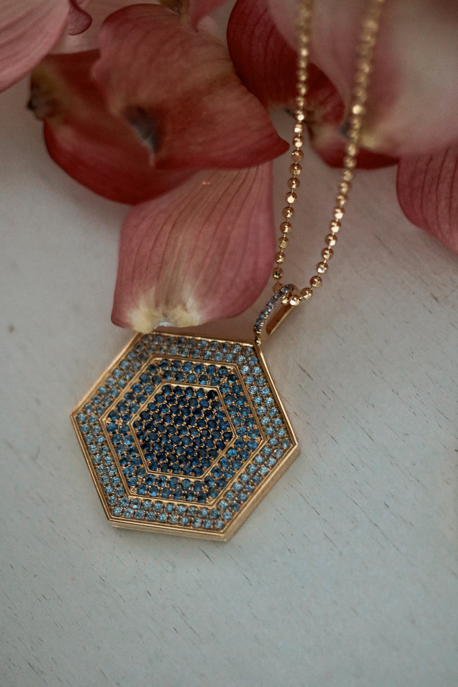 18k gold and blue sapphire hexagonal locket pendant