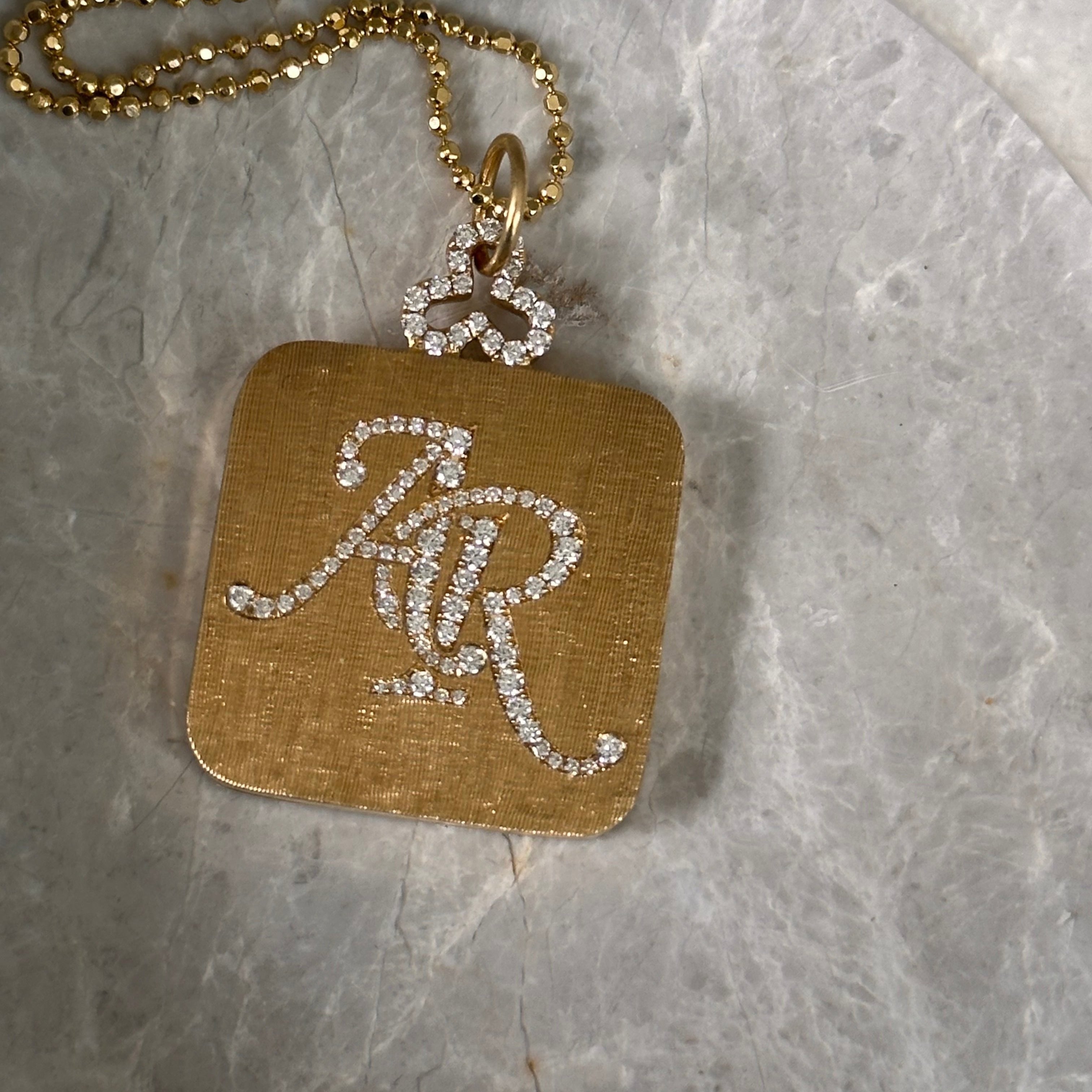 diamond florentine pillow locket necklace in 18k gold with diamond monogram engraving