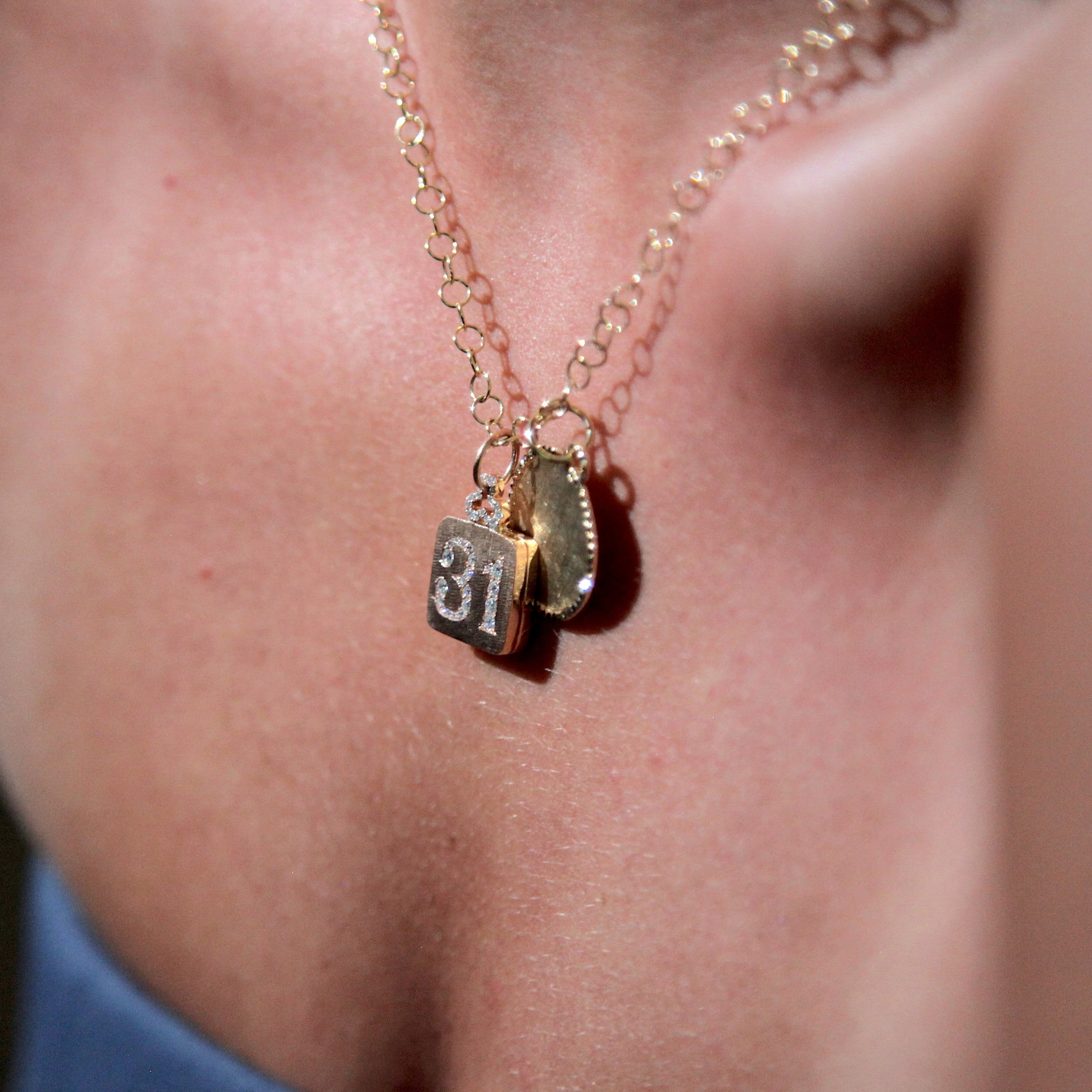 classic diamond trefoil pillow locket necklace in 18k gold with diamond number engraving