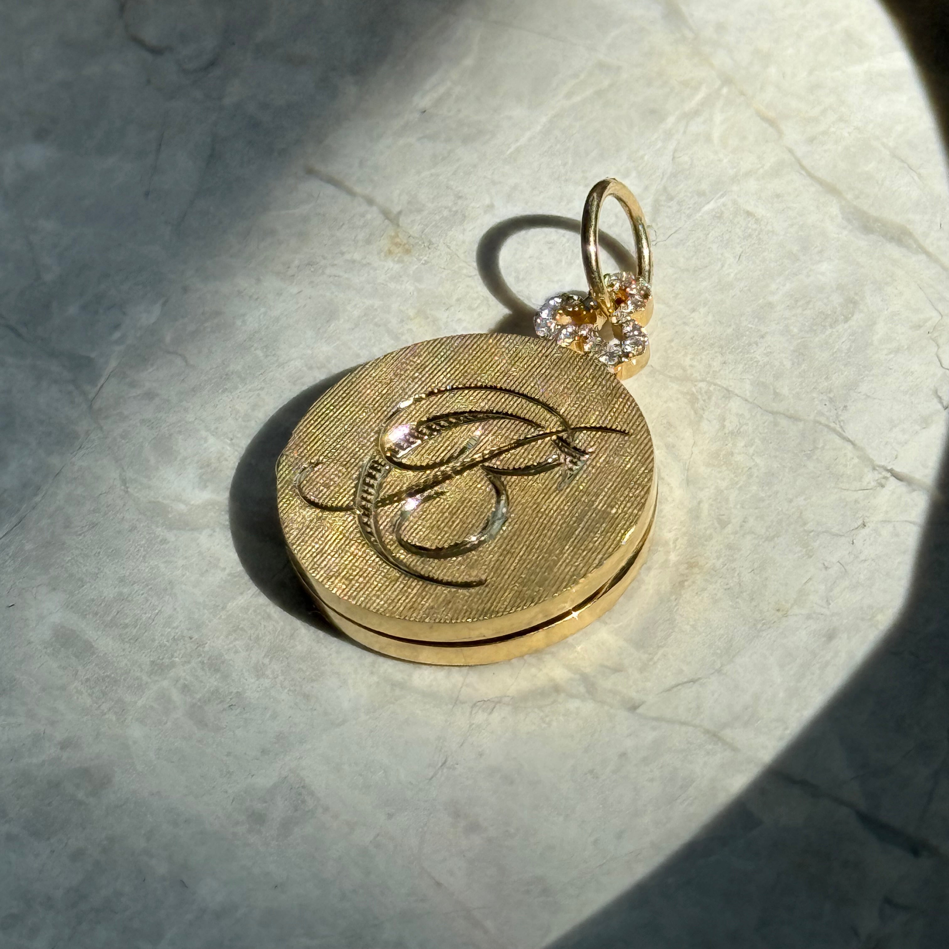 18k gold round classic locket with monogram engraving