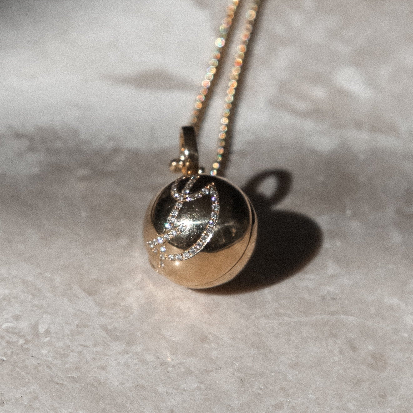 gold ball necklace in 18k gold with diamond engraving