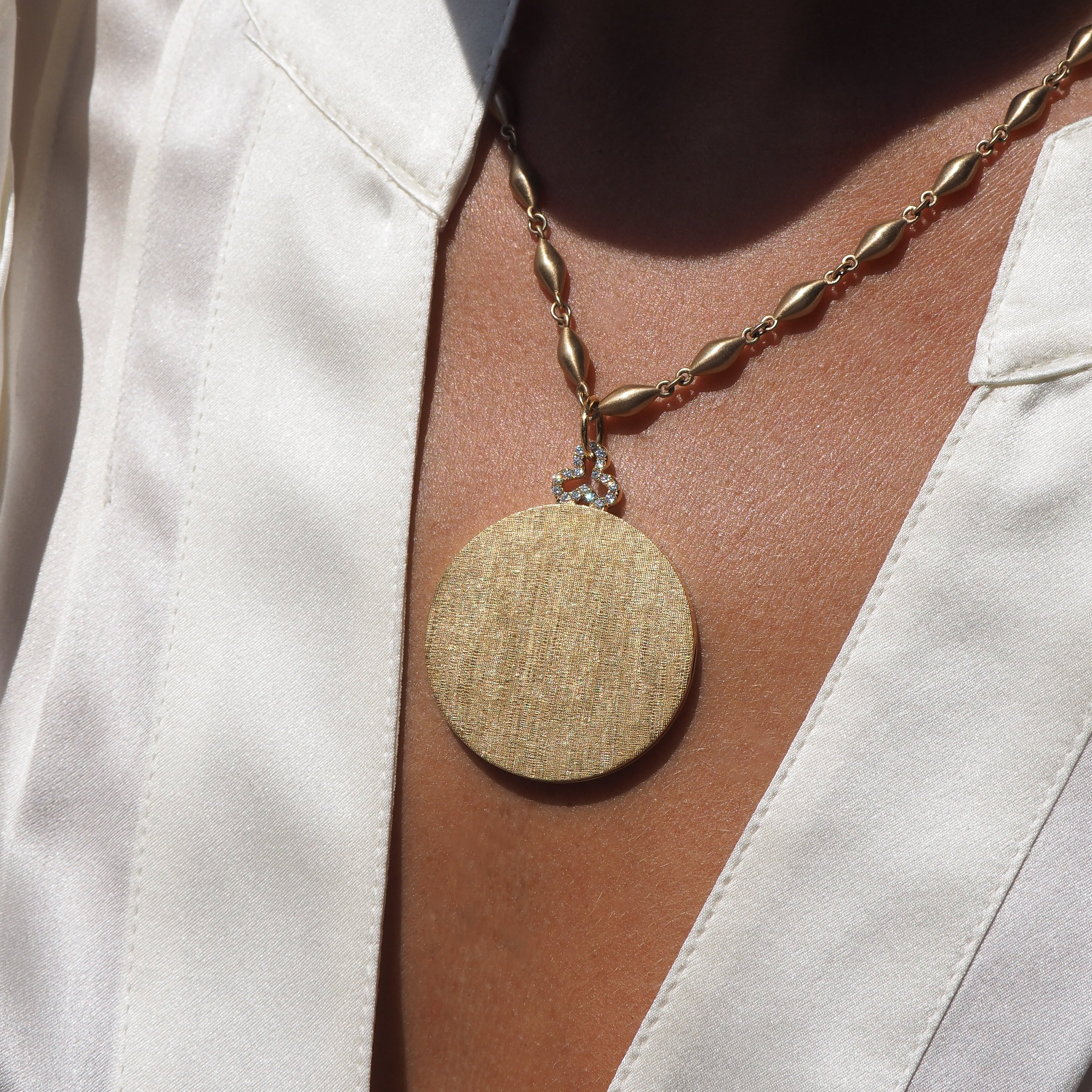 18k gold locket necklace with diamond trefoil