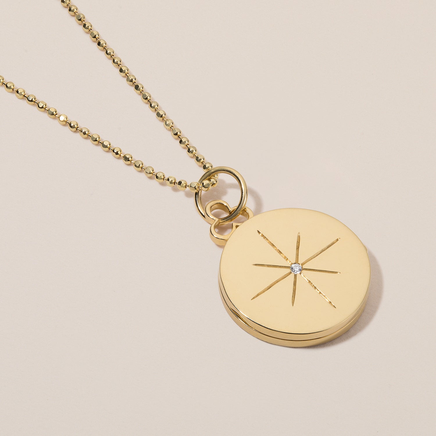 north star locket necklace in 18k gold with diamond 