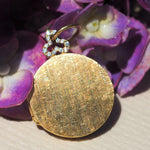 18k gold round classic locket with diamond trefoil