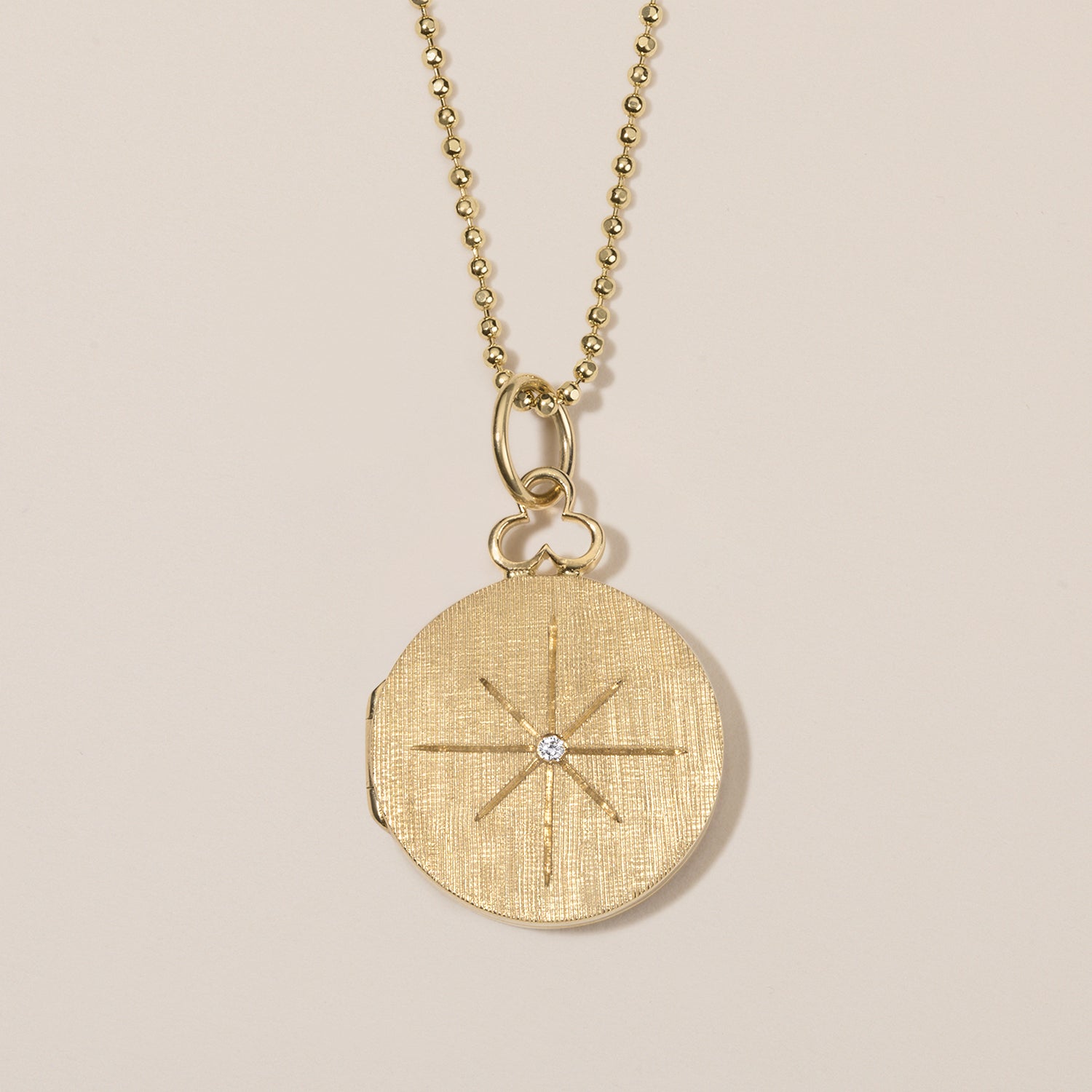 north star locket necklace in 18k gold with diamond 