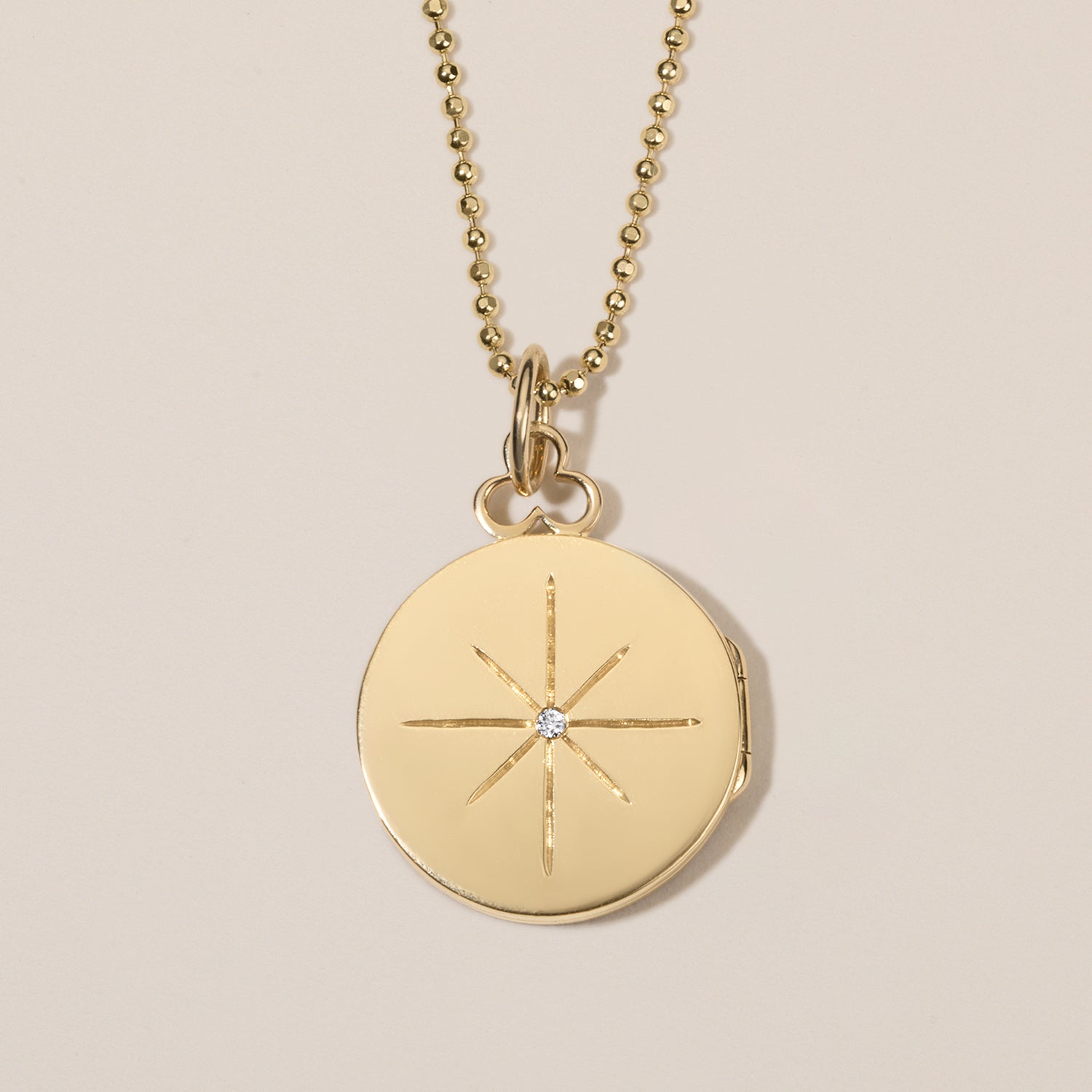 north star locket necklace in 18k gold with diamond 