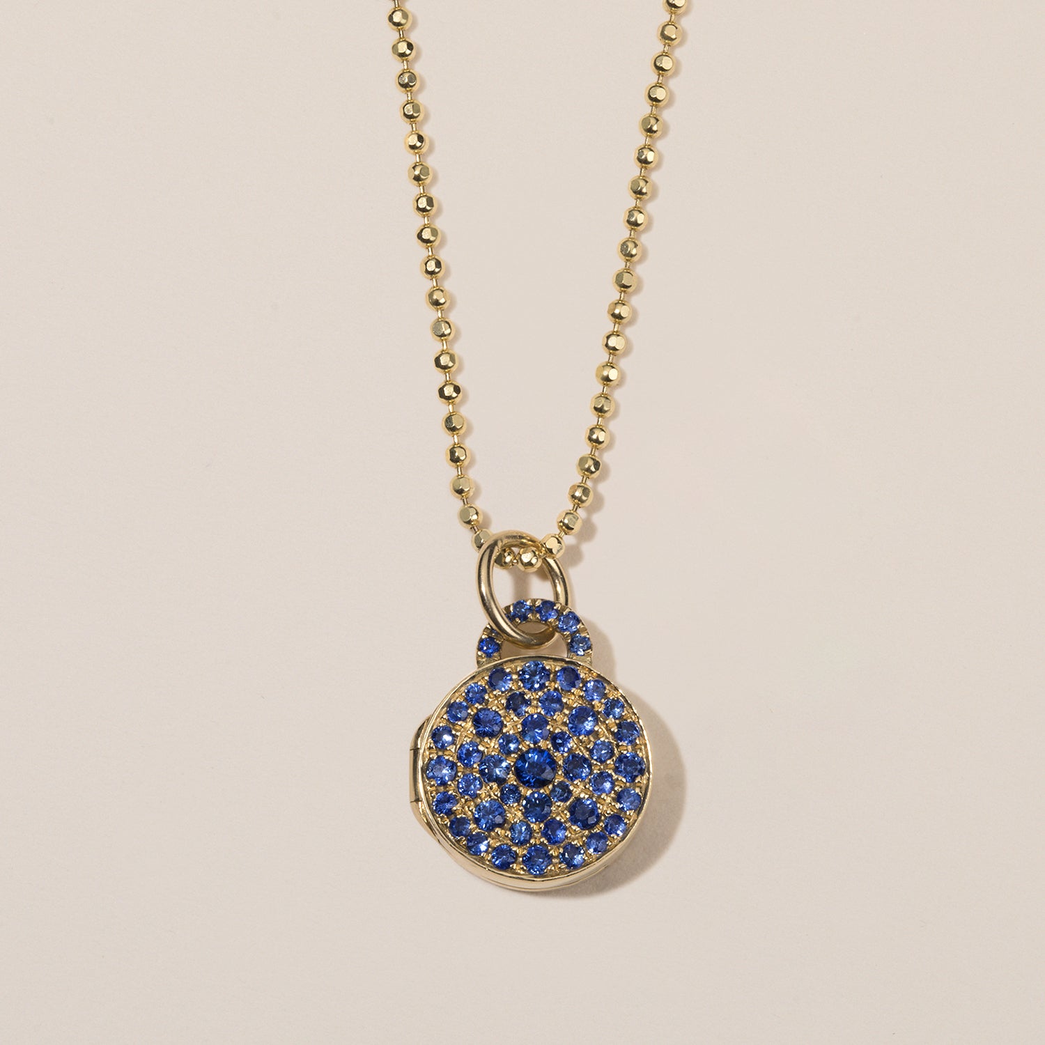 blue sapphire pavé locket in 18k gold