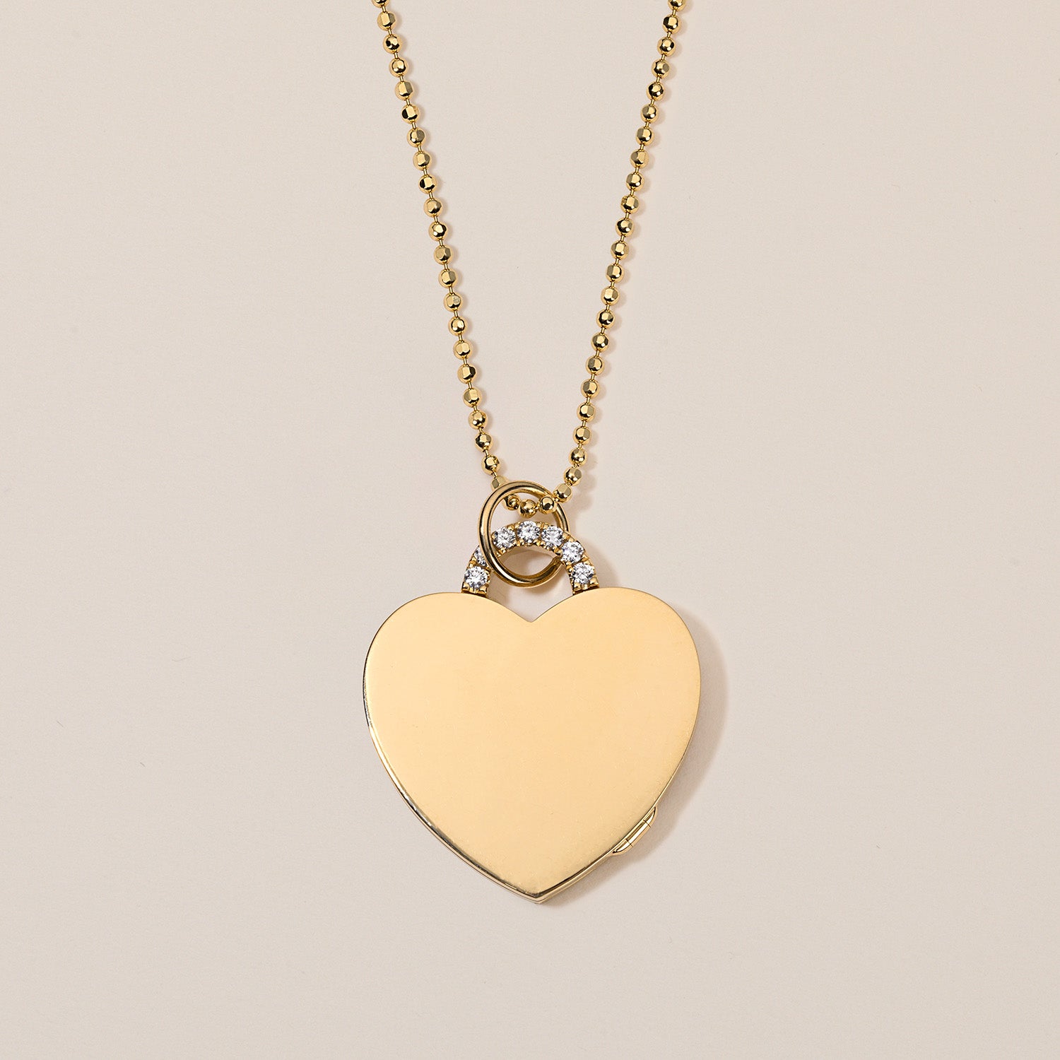 18k gold heart locket necklace with diamond arch