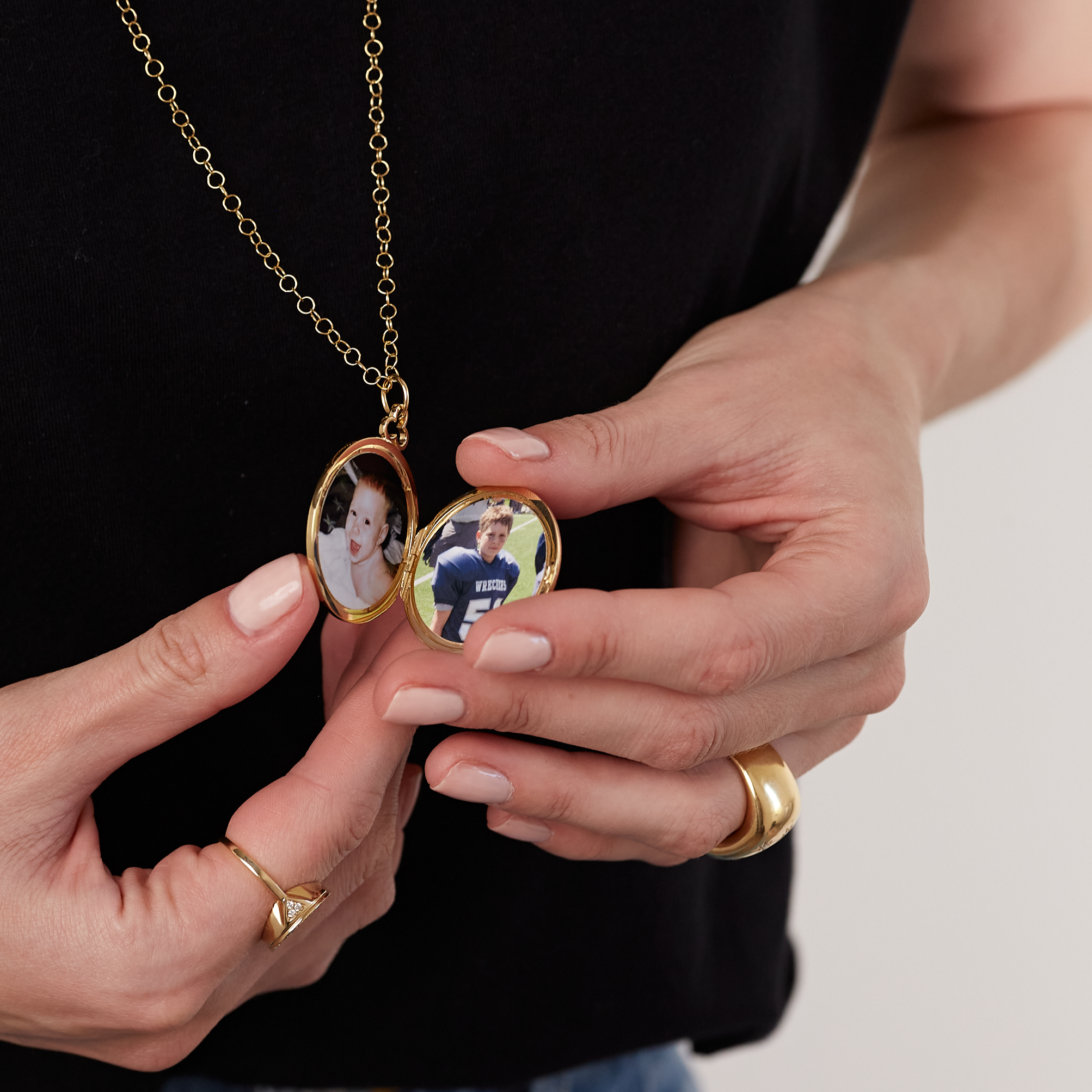 Cherished locket necklace designed to hold precious pictures of kids. This timeless piece is crafted to keep treasured memories close, perfect for capturing the love and joy of family