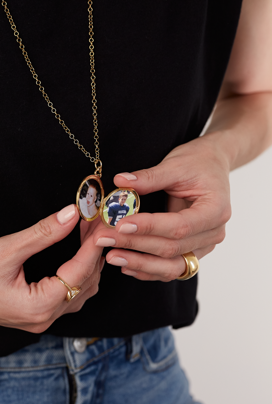 Cherished locket necklace designed to hold precious pictures of kids. This timeless piece is crafted to keep treasured memories close, perfect for capturing the love and joy of family