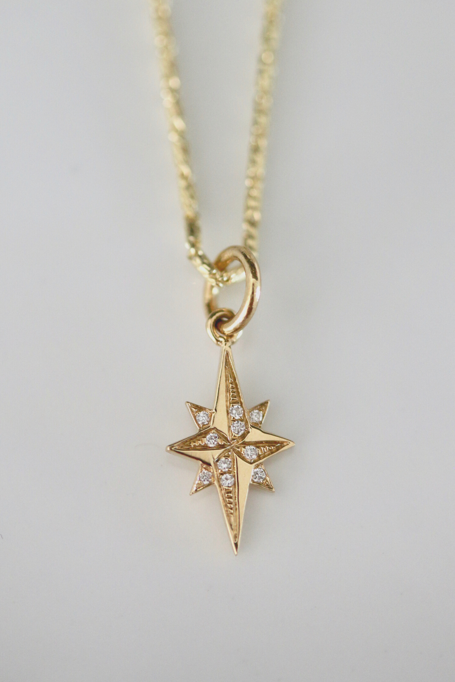 Our Mini Stellar Charm features white diamonds, capturing the brilliance of the stars and adding a touch of celestial glamour to any necklace. The perfect small, yet substantial, gift for someone extra special.