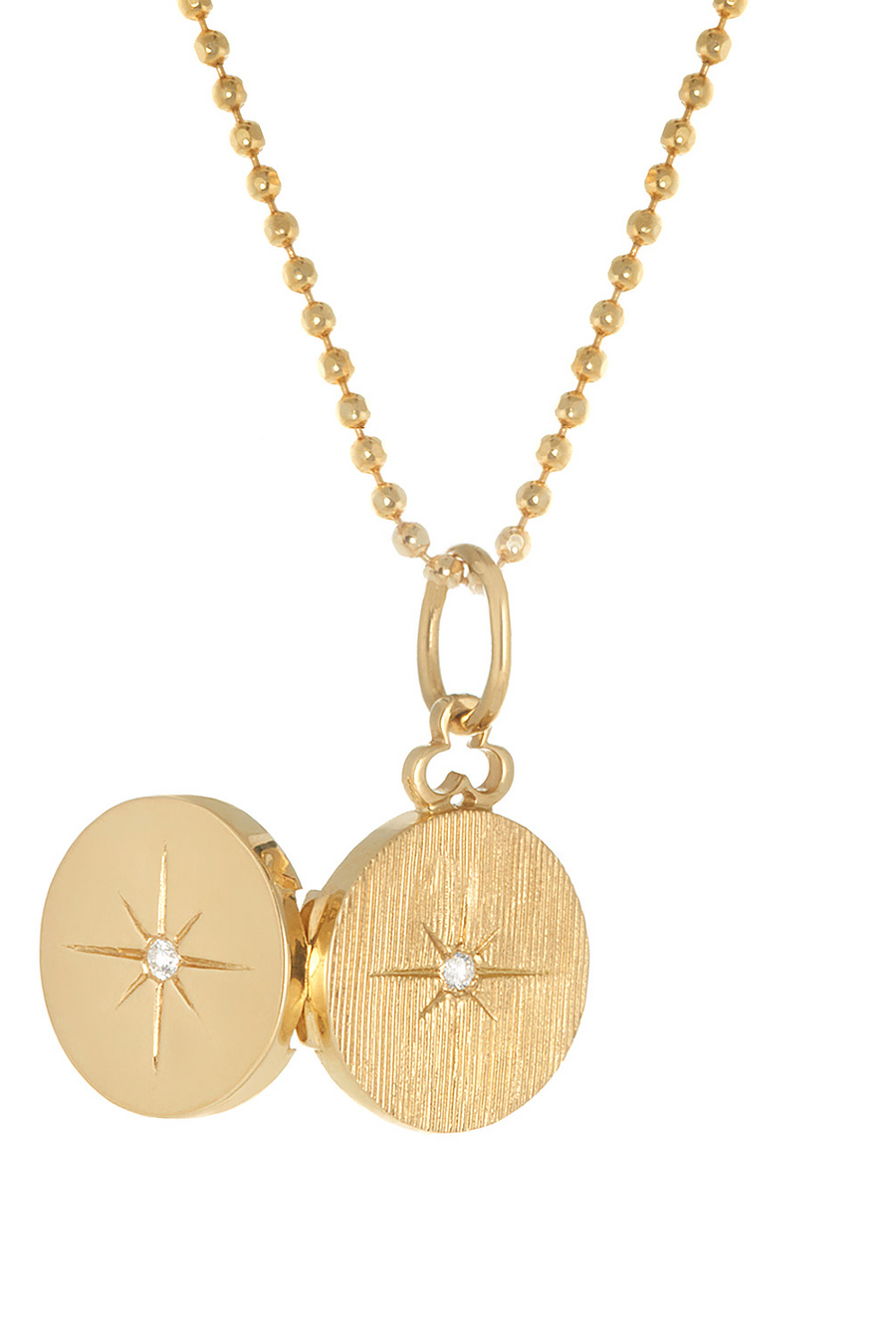 18k gold mini locket with a North Star diamond to carry your photos.