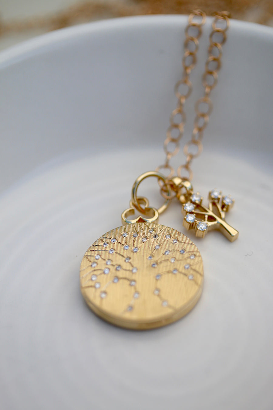 Tree of Life locket necklace crafted in luxurious 18k gold, symbolizing growth and vitality. This exquisite piece features intricate detailing of the Tree of Life motif, adding elegance and charm to any ensemble. Perfect for those seeking timeless beauty and symbolism in their jewelry collection.